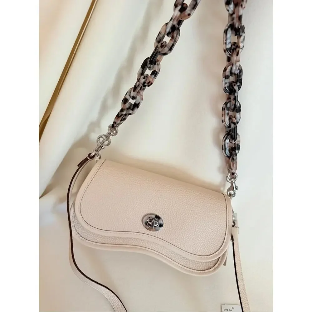 Beige Pebbled Crescent Crossbody Bag Silver Turn Lock Tortoise Chain Strap